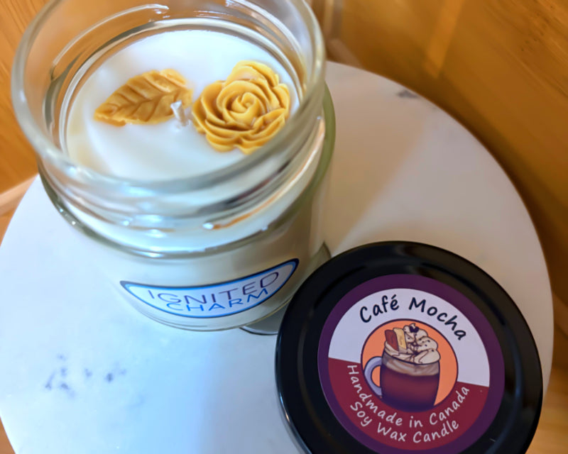 Candle jar with decorative elements and a label on a white surface