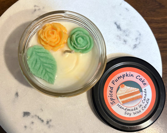 Spiced Pumpkin Cake soy wax candle with decorative elements on a marble surface