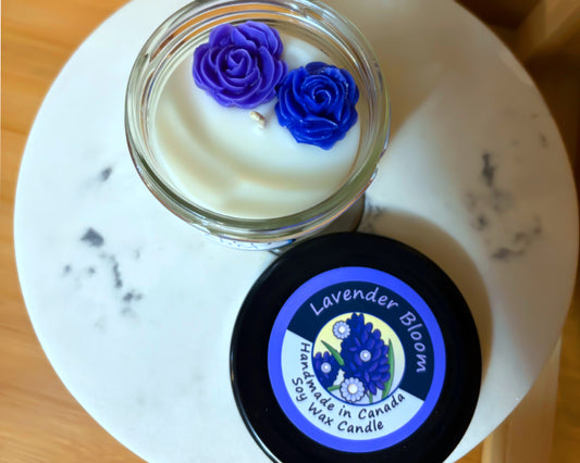 Handmade lavender candle with a black lid featuring a label on a white marble surface.