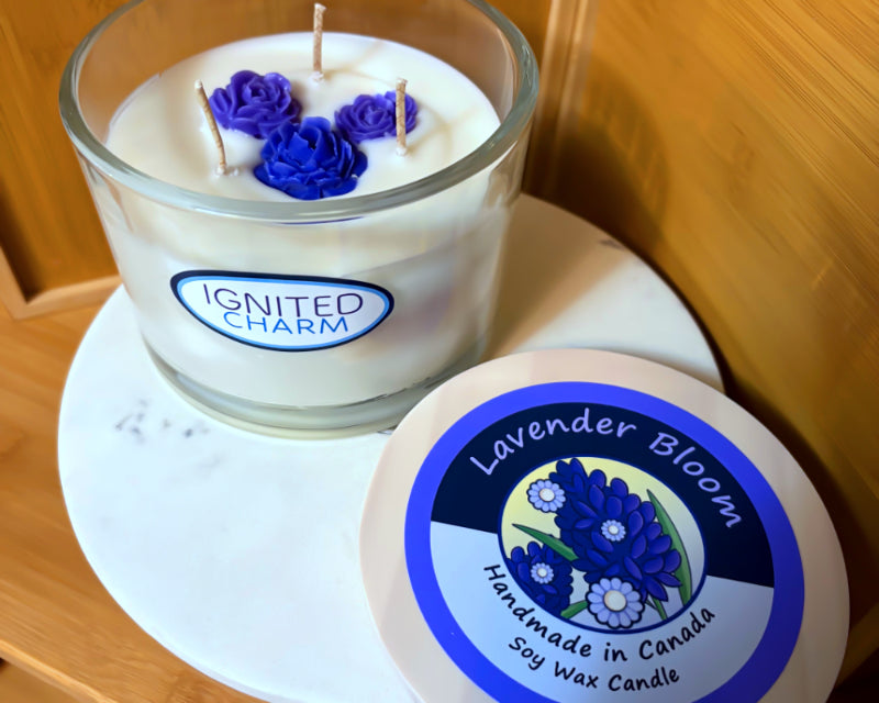 Candle with purple flowers and 'Ignited Charm' label against a wooden background