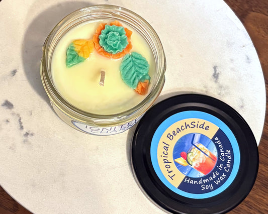 Tropical BeachSide candle with decorative elements on a marble surface